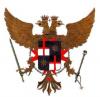 zwei braune Adler mit Krone, in der Mitte ein Wappen in vier Teil unterteilt und mit rotem Kreuz auf weiß-schwarzem Grund